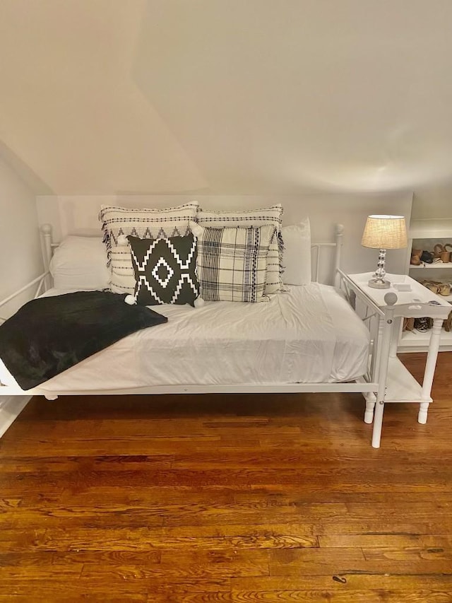 bedroom featuring wood finished floors