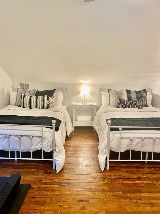 bedroom featuring wood finished floors