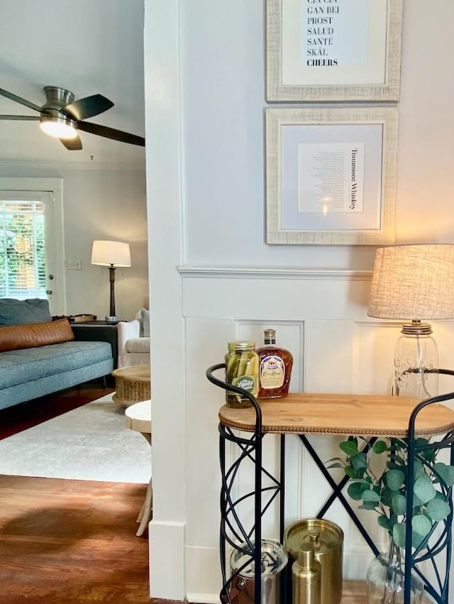 interior space featuring a ceiling fan and wood finished floors