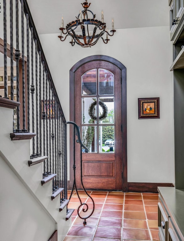 tiled foyer entrance with stairway