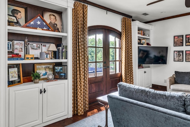 interior space with ceiling fan, visible vents, dark wood finished floors, and french doors