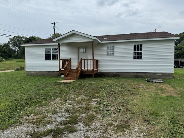 back of house featuring a yard