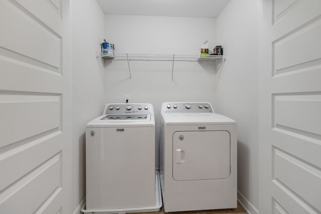 washroom with washing machine and dryer