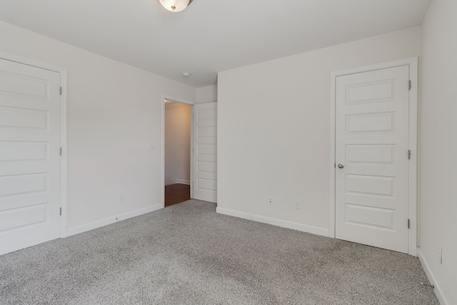 unfurnished bedroom featuring carpet flooring