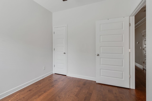 unfurnished bedroom featuring dark wood-type flooring