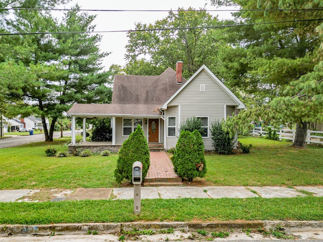 view of front of house with a porch and a front yard