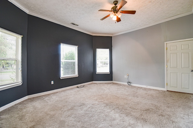 empty room with ceiling fan, carpet, and a textured ceiling