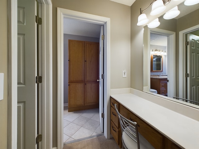 bathroom featuring tile patterned flooring and vanity