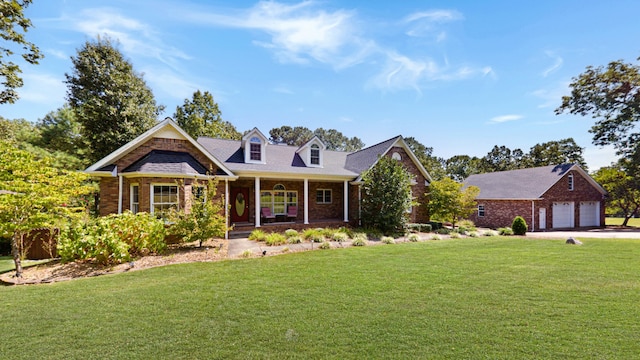 view of front of home featuring a garage, a porch, and a front yard