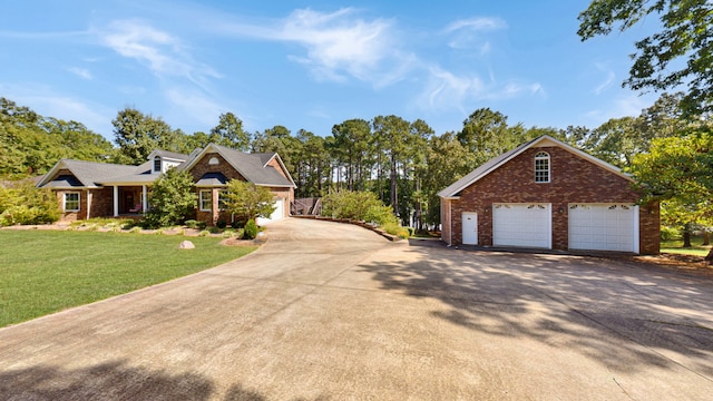 view of front facade with a front lawn and a garage