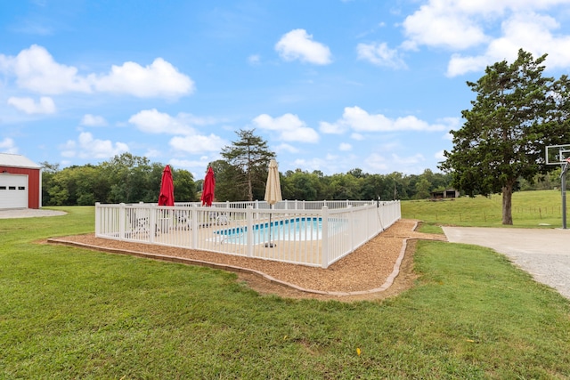 view of swimming pool with a lawn