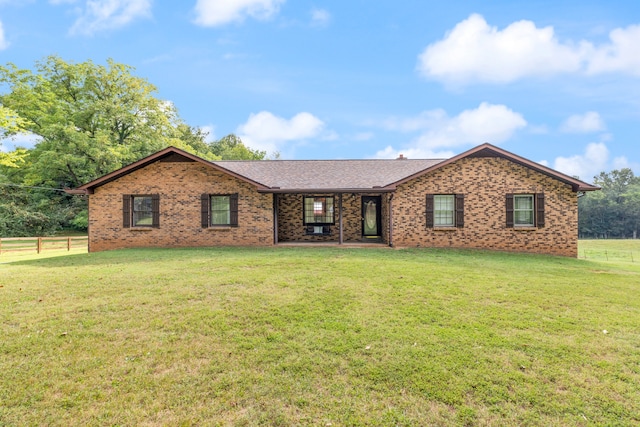 ranch-style home with a front yard