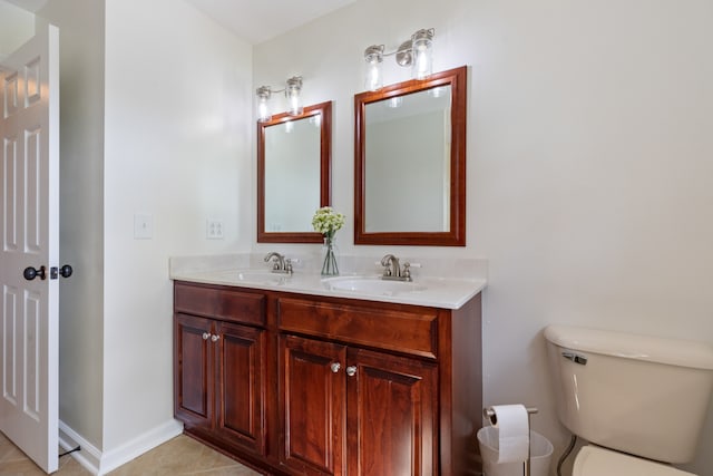 bathroom with tile patterned floors, vanity, and toilet