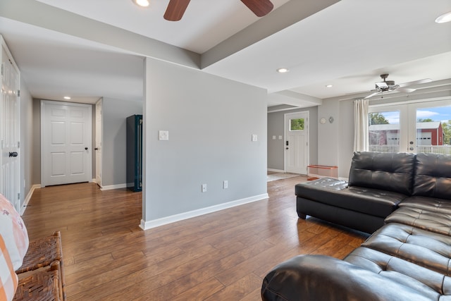 living room with ceiling fan, hardwood / wood-style flooring, and french doors