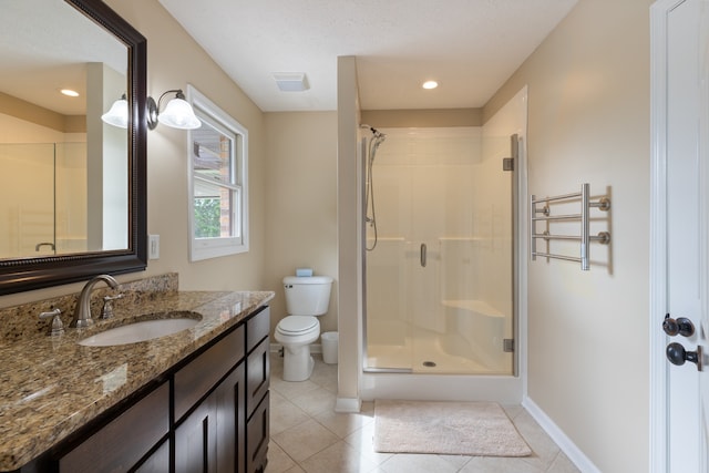 bathroom with tile patterned flooring, an enclosed shower, toilet, and vanity