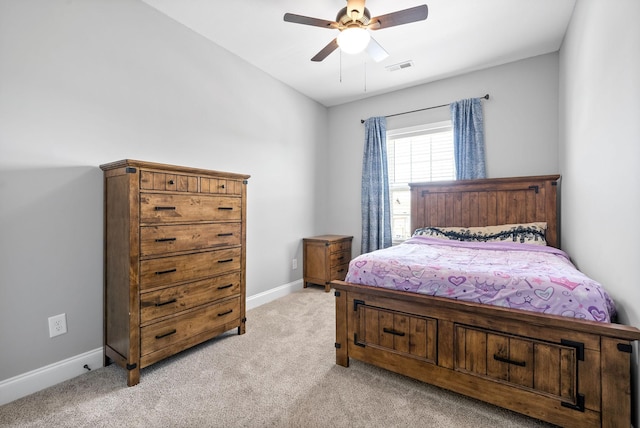 bedroom featuring light carpet, baseboards, visible vents, and a ceiling fan