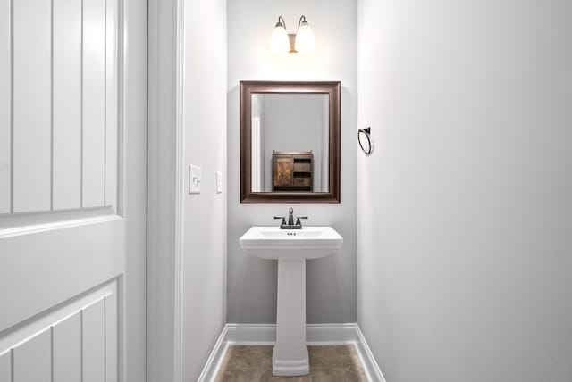 bathroom with tile patterned floors