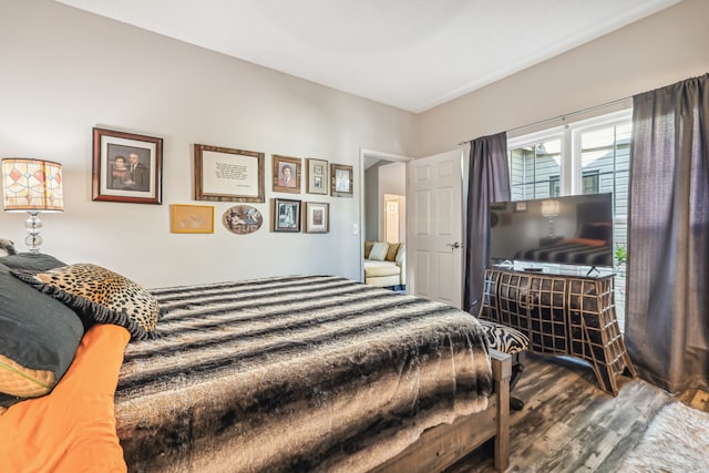 bedroom with dark wood-type flooring