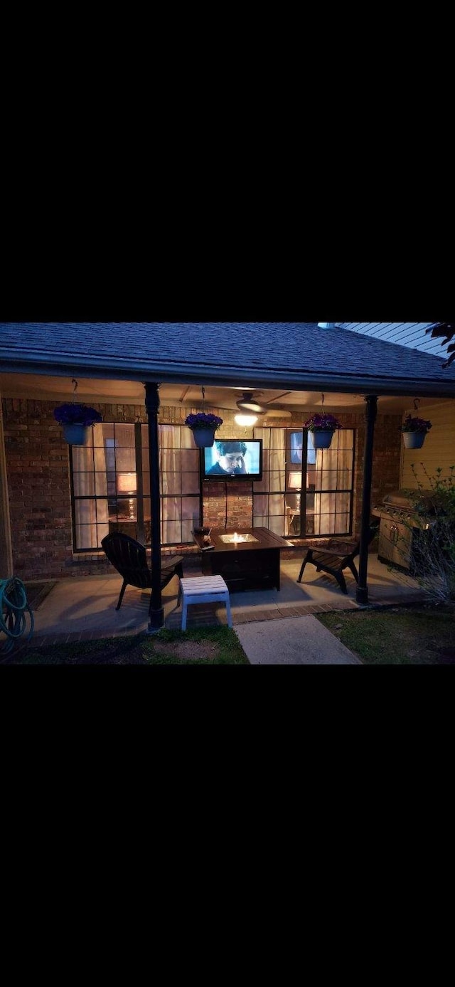 rear view of property featuring a patio