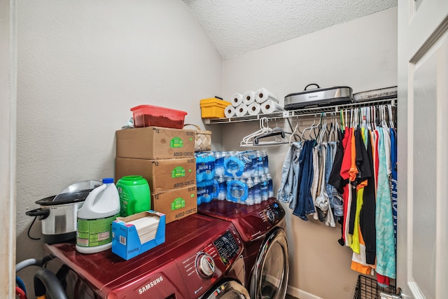 walk in closet with washing machine and clothes dryer and vaulted ceiling