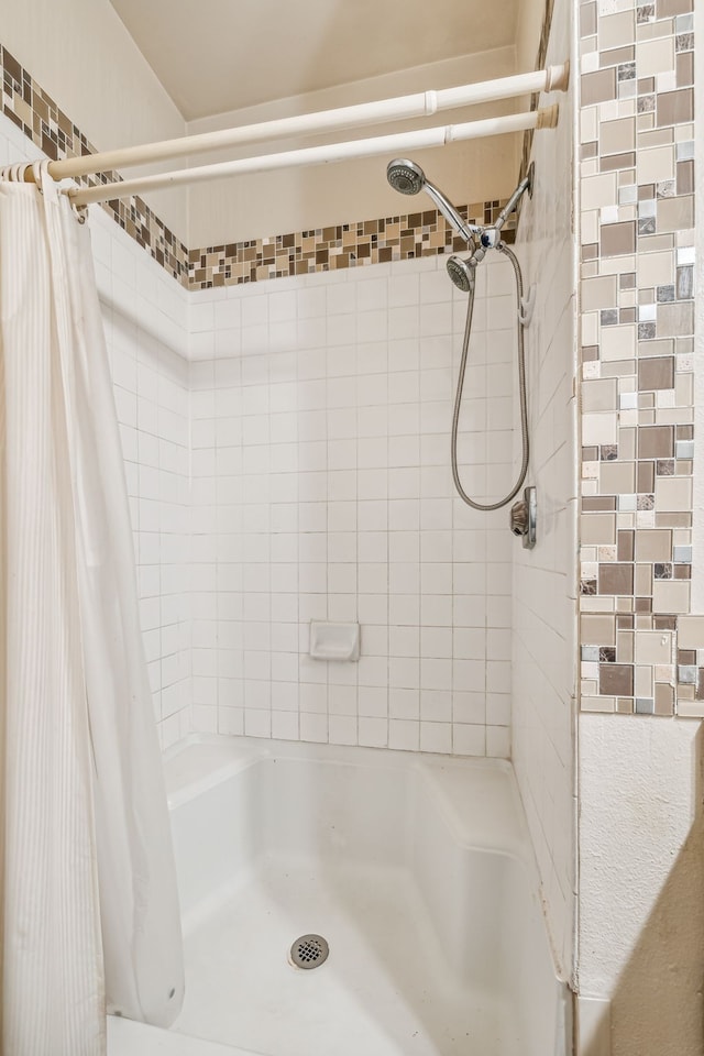 bathroom with a shower with shower curtain