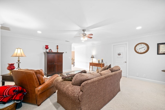 carpeted living room with ornamental molding and ceiling fan