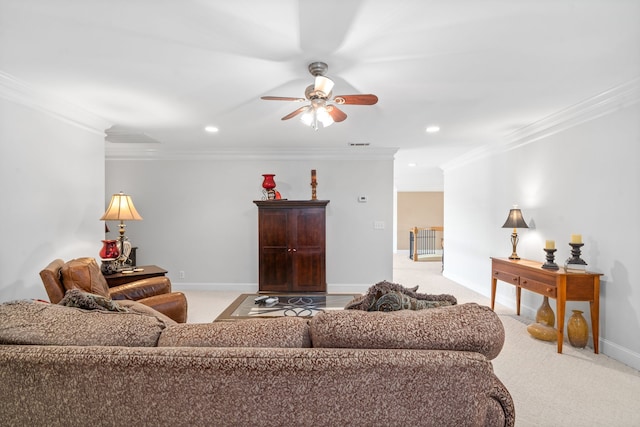 living room featuring ceiling fan, light colored carpet, and ornamental molding