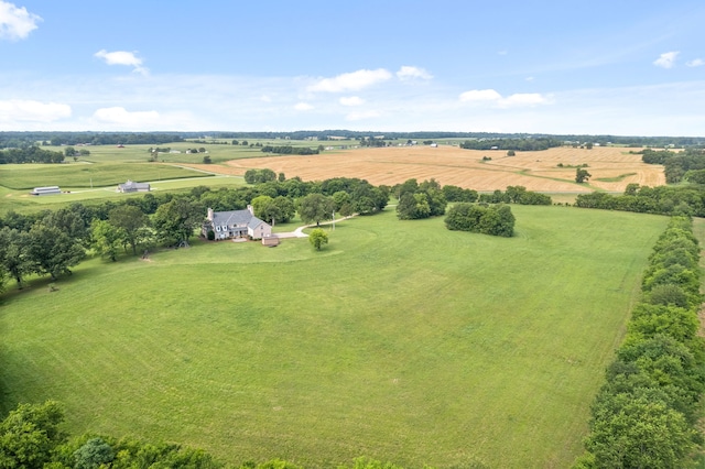 birds eye view of property with a rural view