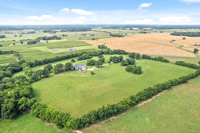 birds eye view of property with a rural view