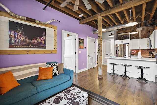 610 21st Ave N Unit 101, Nashville, TN 37203 - living room featuring dark wood-type flooring and baseboards