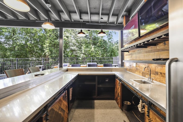 610 21st Ave N Unit 101, Nashville, TN 37203 - view of patio featuring a sink, area for grilling, and view of wooded area