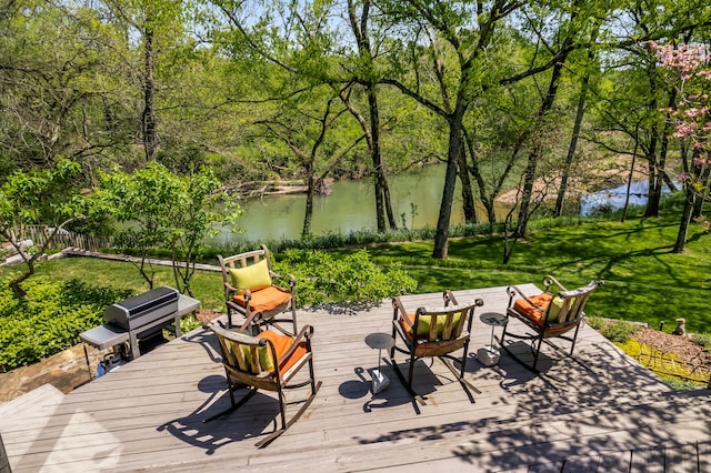 wooden deck with a water view