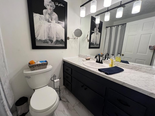 bathroom featuring toilet, tile patterned floors, and vanity