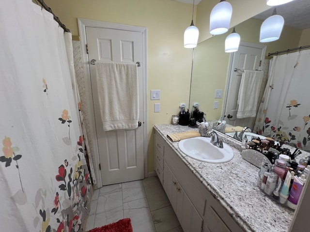 bathroom featuring tile patterned flooring and vanity