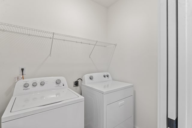 washroom with washing machine and dryer