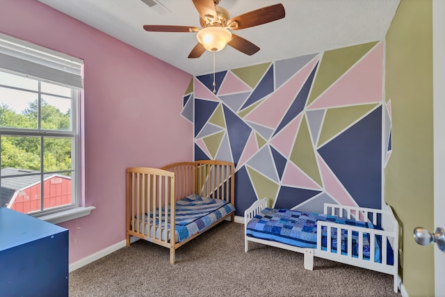 carpeted bedroom featuring ceiling fan