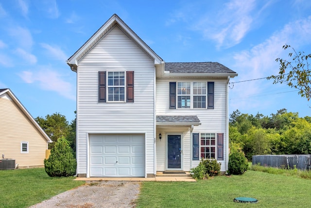 front of property featuring a front lawn, central AC unit, and a garage