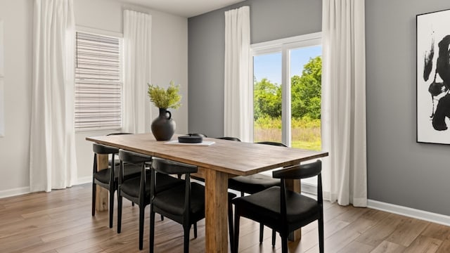 dining space featuring light hardwood / wood-style floors