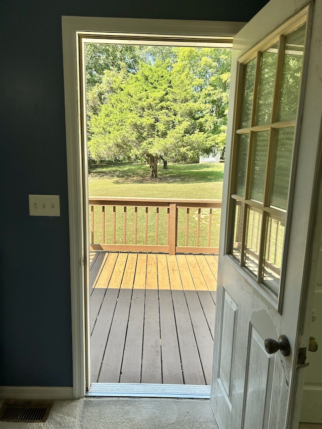 doorway with hardwood / wood-style floors