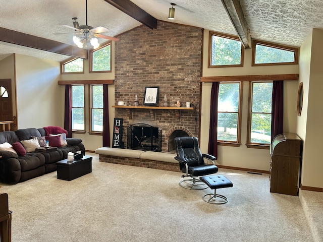 carpeted living room featuring high vaulted ceiling, a fireplace, beam ceiling, a textured ceiling, and ceiling fan