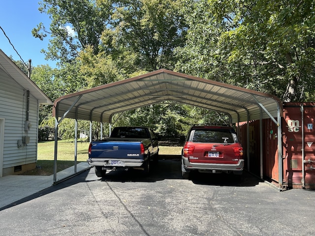 view of parking / parking lot with a carport