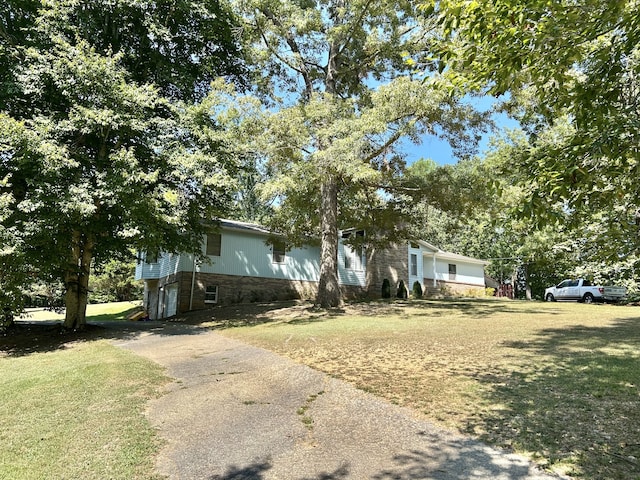 view of home's exterior with a lawn