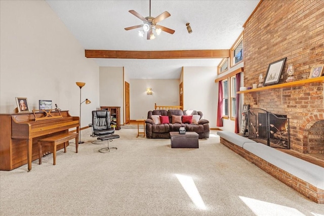 carpeted living area with baseboards, beam ceiling, a high ceiling, ceiling fan, and a brick fireplace