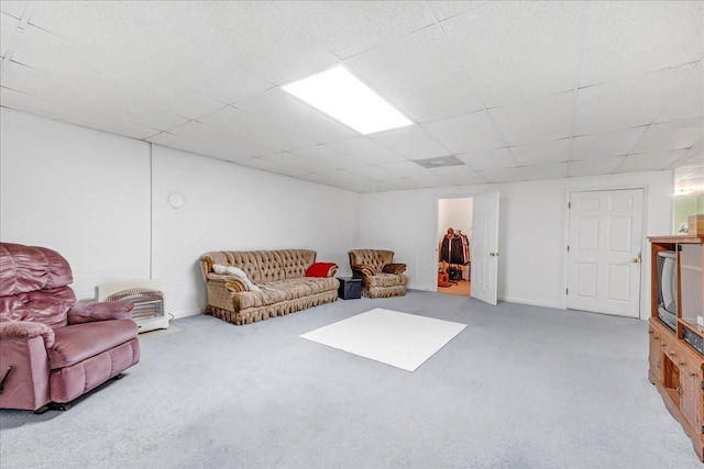 interior space with a paneled ceiling