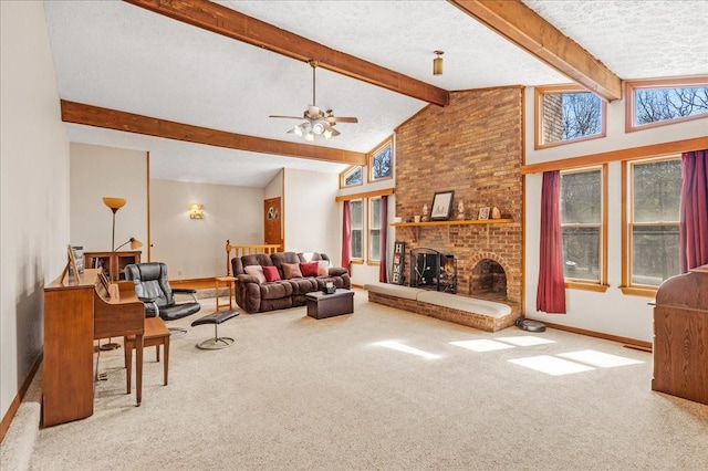 carpeted living area featuring baseboards, beam ceiling, a textured ceiling, and a fireplace