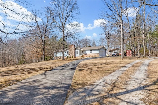 view of road featuring aphalt driveway