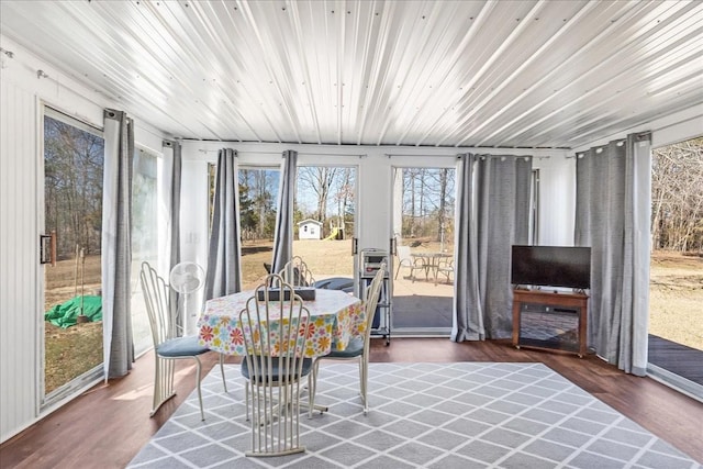 sunroom featuring wood ceiling