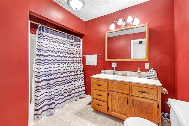 bathroom with toilet, a shower with shower curtain, vanity, tile patterned floors, and a textured ceiling