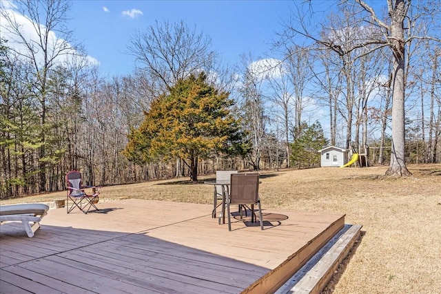 deck with an outdoor structure and a shed