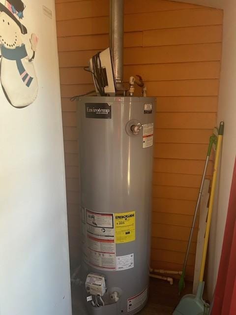 utility room with water heater